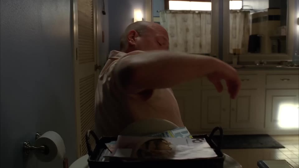 The wire basket on the toilet tank