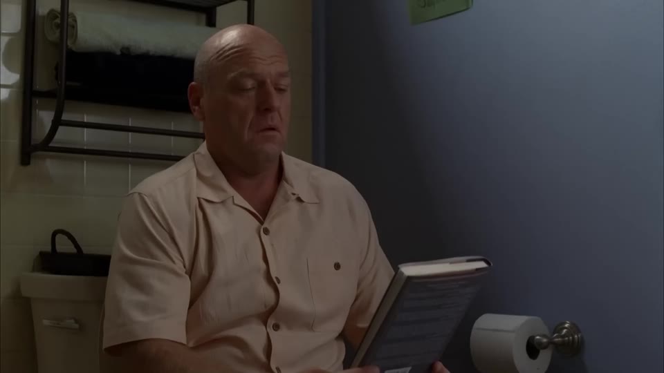 Hank in the front view with the closed book in his hands